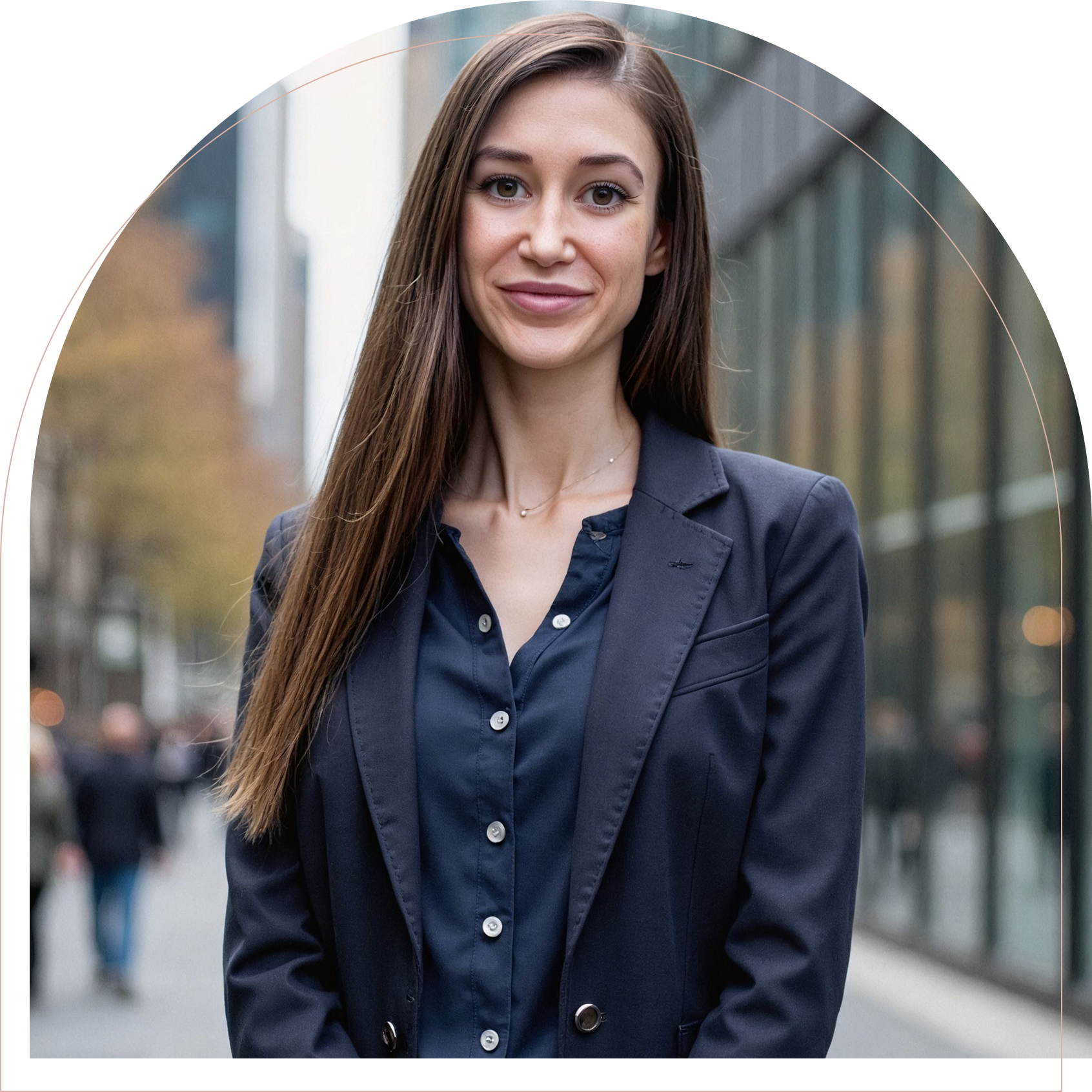 Professional woman in a navy blazer smiles confidently outdoors in an urban setting.